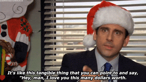 GIF from the Office with Michael Scott in a Santa hat saying: It's like this tangible thing that you can point to and say, "Hey, man, I love you this many dollars worth."